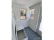 Bright sunroom featuring gray painted floors, natural light and built in bench storage at 2507 Florida Ave, Kannapolis, NC 28083