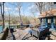 Outdoor deck with lake view, ample seating, and outdoor dining area at 353 Whippoorwill Rd, Mooresville, NC 28117