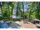 Spacious wooden deck with lake views, outdoor seating and dining. Perfect for entertaining and enjoying the scenery at 353 Whippoorwill Rd, Mooresville, NC 28117
