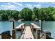 Inviting lake view from private boat dock, ready for summer fun and relaxation on the water at 353 Whippoorwill Rd, Mooresville, NC 28117
