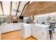 Open-concept living area with fireplace and vaulted ceiling flowing into the kitchen and dining areas at 353 Whippoorwill Rd, Mooresville, NC 28117