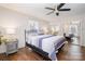 Primary bedroom featuring natural light, closet with mirrored doors, and simple modern furnishings at 353 Whippoorwill Rd, Mooresville, NC 28117
