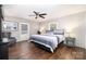 Cozy primary bedroom with natural light, a ceiling fan, and a mix of textures and patterns at 353 Whippoorwill Rd, Mooresville, NC 28117