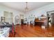 Spacious living room with hardwood floors, fireplace, and natural light at 3530 Statesville Blvd, Salisbury, NC 28147