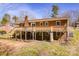 View of brick house featuring a spacious back deck, perfect for outdoor entertaining and relaxation at 3617 12Th Street Ne Dr, Hickory, NC 28601