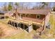 Brick home features a large wood deck for outdoor enjoyment, situated in a mature setting at 3617 12Th Street Ne Dr, Hickory, NC 28601