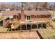 Spacious brick home showcasing an expansive wooden deck and a well-kept backyard at 3617 12Th Street Ne Dr, Hickory, NC 28601