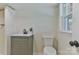 Updated bathroom featuring a gray vanity, sleek fixtures, and a shower with white-tiled walls at 3617 12Th Street Ne Dr, Hickory, NC 28601