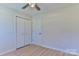 Bright bedroom with closet, ceiling fan and light-colored floor at 3617 12Th Street Ne Dr, Hickory, NC 28601