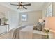 Comfortable bedroom featuring a ceiling fan, closet, and large window at 3617 12Th Street Ne Dr, Hickory, NC 28601