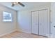 Bright bedroom with closet, neutral walls, ceiling fan and window at 3617 12Th Street Ne Dr, Hickory, NC 28601