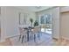 Dining room with modern furniture, a neutral rug, and sliding glass doors to the deck at 3617 12Th Street Ne Dr, Hickory, NC 28601
