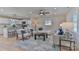 Bright living room open to a modern white kitchen with a large island and bar seating at 3617 12Th Street Ne Dr, Hickory, NC 28601