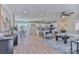 Open-concept living space flows into a modern kitchen with bar seating and a sunny dining area at 3617 12Th Street Ne Dr, Hickory, NC 28601