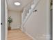 Entryway staircase with white railings and light colored floors at 3617 12Th Street Ne Dr, Hickory, NC 28601
