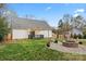 A home's backyard with a brick fire pit and partially covered deck at 4053 Crestview Dr, Rock Hill, SC 29732