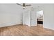 Cozy bedroom featuring hardwood floors, a ceiling fan, a closet, neutral walls, and an open door at 4053 Crestview Dr, Rock Hill, SC 29732