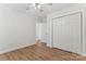A bedroom with wood-look flooring, white walls, and a closet with white bi-fold doors at 4053 Crestview Dr, Rock Hill, SC 29732