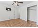 Neutral bedroom features wood floors, ceiling fan, closet, and mounted TV at 4053 Crestview Dr, Rock Hill, SC 29732