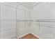 Walk-in closet with metal shelving and wood-look flooring at 4053 Crestview Dr, Rock Hill, SC 29732