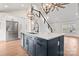 Kitchen island with sleek countertops and stainless steel appliances, open to a naturally-lit living space at 4053 Crestview Dr, Rock Hill, SC 29732