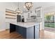 Open kitchen featuring an island with stainless steel appliances, floating shelves, and ample counter space at 4053 Crestview Dr, Rock Hill, SC 29732