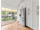 Modern kitchen featuring stainless steel appliances, white cabinetry, and a sliding glass door leading to a deck at 4053 Crestview Dr, Rock Hill, SC 29732