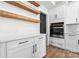 Kitchen with white cabinetry, stainless steel oven, stone countertops and rustic wood shelving at 4053 Crestview Dr, Rock Hill, SC 29732