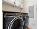 Modern laundry room with black washer and dryer and white cabinetry at 4053 Crestview Dr, Rock Hill, SC 29732