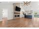 Open-concept living room featuring a sleek fireplace, high ceilings, and kitchen view to sliding glass doors at 4053 Crestview Dr, Rock Hill, SC 29732