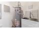 Well-maintained utility room with water heater, sink, and storage space at 4053 Crestview Dr, Rock Hill, SC 29732