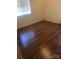 Bright bedroom with wood-look flooring, neutral walls, and natural light from a window at 4343 Saluda Rd, Rock Hill, SC 29730