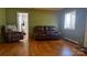 Comfortable living room featuring hardwood floors and plush brown leather seating at 4343 Saluda Rd, Rock Hill, SC 29730