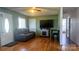 Inviting living room with hardwood floors, a decorative fireplace, and a comfortable leather sofa at 4343 Saluda Rd, Rock Hill, SC 29730