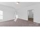 Bedroom with neutral carpet and white walls featuring doorway access to other rooms at 447 Lookout Dam Rd, Statesville, NC 28625