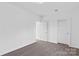Bright bedroom with plush carpet, natural light, and neutral color scheme at 447 Lookout Dam Rd, Statesville, NC 28625