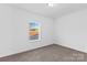 Bedroom with carpet flooring, natural light, and neutral color scheme at 447 Lookout Dam Rd, Statesville, NC 28625