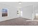 Bright bedroom with plush carpet, natural light, and neutral color scheme at 447 Lookout Dam Rd, Statesville, NC 28625