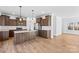 Spacious kitchen featuring wood cabinets, stainless steel appliances, a center island, and hardwood floors at 447 Lookout Dam Rd, Statesville, NC 28625