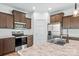 Modern kitchen featuring wood cabinets, granite countertops, stainless steel appliances and views to the deck at 447 Lookout Dam Rd, Statesville, NC 28625
