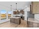 Modern kitchen featuring wood cabinets, granite countertops, stainless steel appliances and views to the deck at 447 Lookout Dam Rd, Statesville, NC 28625