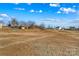 A view of the land featuring a potential building lot with mature trees in a neighborhood setting at 447 Lookout Dam Rd, Statesville, NC 28625