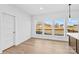 Bright dining area features hardwood floors, white walls, and large windows with lovely neighborhood view at 447 Lookout Dam Rd, Statesville, NC 28625