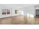Bright living room with wood floors and large windows providing natural light at 447 Lookout Dam Rd, Statesville, NC 28625