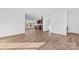 Spacious living room with wood floors connecting to kitchen, offering an open floor plan at 447 Lookout Dam Rd, Statesville, NC 28625