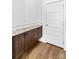 Mud room features stone countertops, wood cabinets, and wood flooring at 447 Lookout Dam Rd, Statesville, NC 28625