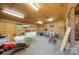 The large shed provides ample storage and workspace, featuring wood ceiling at 565 Dunns Mountain Church Rd, Salisbury, NC 28146