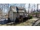 Wood deck and stairs lead to spacious backyard with privacy fence and mature trees at 608 Bubbling Well Rd, Matthews, NC 28105