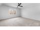 Bedroom featuring large windows and a ceiling fan at 608 Bubbling Well Rd, Matthews, NC 28105