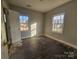 Bright bedroom featuring two windows allowing natural light to fill the room at 6705 Edenwood Pl, Charlotte, NC 28212